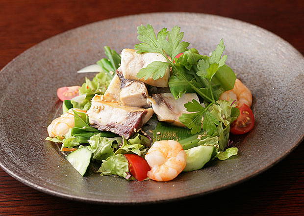 Salad with local green leaf and octopus